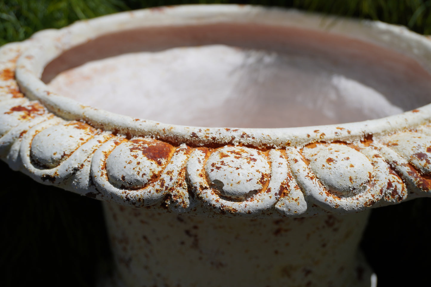 zoomed in Medici Urn showcasing rust