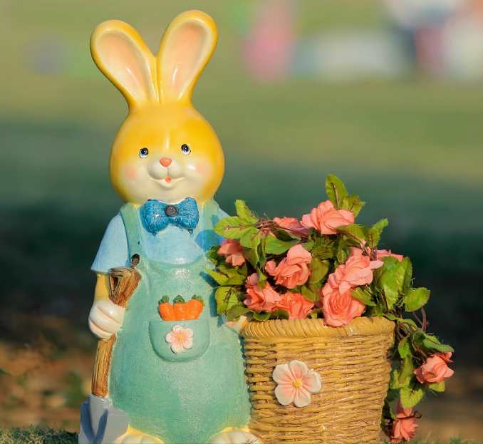 Cute bunny carrying shovel and flowers