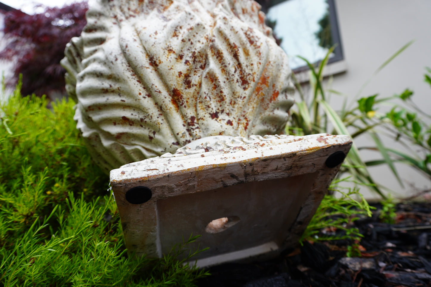 aged leaf urn view from under
